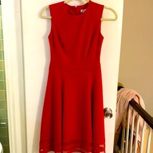 Red Calvin Klein align dress with covered zipper in back.